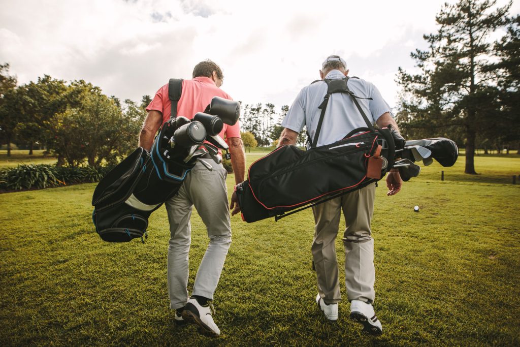 Two seniors playing a round of golf
